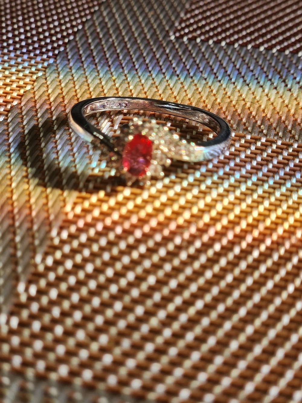Sterling Silver Ring with Red Center Stone and Accent Diamonds